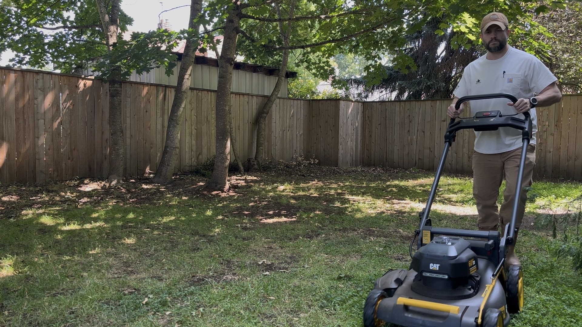 Urban Yards groundskeeping lawn care with electric mower.